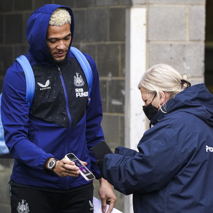 Joelinton scans his pass to gain access to St James' Park