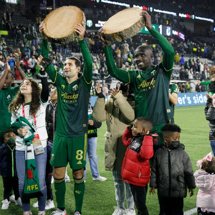 The Portland Timbers hoist the traditional tree trunks after a 3-1 win over Minnesota United