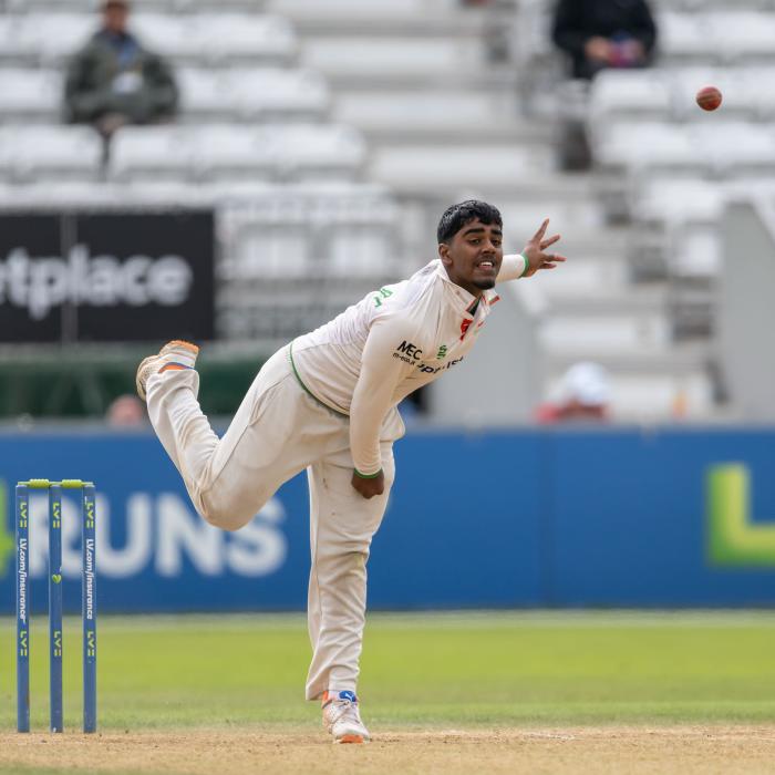 Rehan Ahmed bowling for Leicestershire during a County Championship match against Derbyshire
