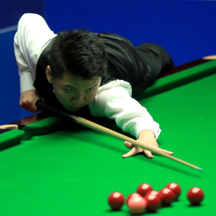 Zhou Yuelong during his match against Ding Junhui on day three of the Betfred Snooker World Championships